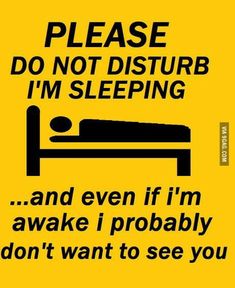 a yellow sign that says please do not disturb i'm sleeping and even if i'm awake i probably don't want to see you