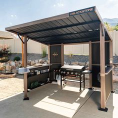 an outdoor bbq with grills and barbecue tables