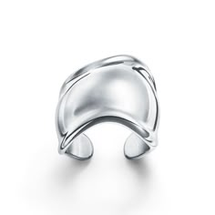 A nod to the sublime beauty found in nature, the Elsa Peretti® Bone ring is defined by sensuous contours that become one with the body. Powerful with an effortless ease, the Bone ring was inspired by the groundbreaking Bone cuff design first introduced in 1970. Sculpted to conform to your finger, this sterling silver ring makes a bold statement worn traditionally or on a knuckle. Sterling silver; This ring runs a half size to a full size bigger when worn traditionally on your finger, and a full Bone Cuff, Bone Ring, Cuff Design, Elsa Peretti, Tiffany And Co, The Bone, Open Ring, Watches Jewelry, Ring Silver