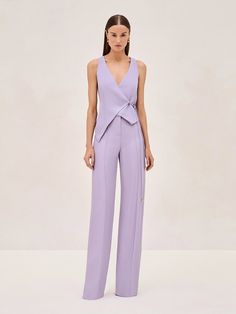 Experience the elegance of simplicity with the Cain Vest. Featuring a deep V-neckline and a wrap silhouette, secured by a side tie that emphasizes the waist. Paired perfectly with the Rex Pant, this duo will be your go to this summer. Modern Pantsuit Women, Women 2 Piece Suit, Cinched Waist Coat, Cocktail Attire Women Pants, Pant Dresses For Women, T Silhouette Fashion, Women's Pant Suit, Short Sleeve Suits For Women, Fun Formal Outfits