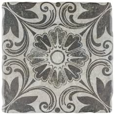 a square tile with an ornate design on the front and back side, in grey tones