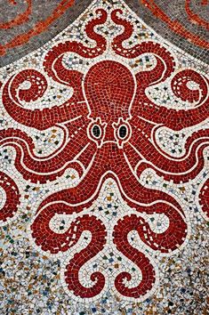 an octopus mosaic on the side of a building with words instagramm above it