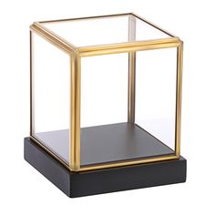 a black and gold square shaped object on a white background