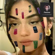 a woman with her face covered in stickers