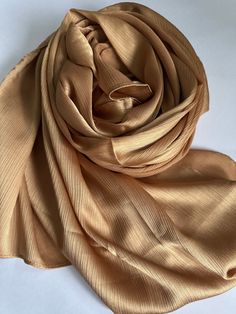 STUNNING LUXURY SOFT DEEP GOLD SCARF Beautiful delicate soft lightweight textured scarf This scarf is a perfect accessory for both daytime and evening wedding wear worn as a shawl & wrap  Made from silk 30% Viscose 70% colour-Deep Gold   188cm length x 140cm width (approx)  Note: The colour of the scarf may appear slightly different in person as screen settings and lighting can affect how it looks on the phone or computer. Luxury Champagne, Gold Scarf, Silk Shawl, Wrap Scarf, Evening Wedding, Shawl Wrap, Champagne Gold, Golden Color, Wedding Wear