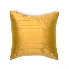 a yellow pillow with pleated edges on a white background, it looks like an elegant cushion