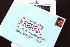 two envelopes with the words kreifer written on them, and an image of a christmas tree