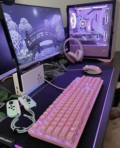 a computer desk with two monitors and a keyboard on top of it, next to a gaming controller