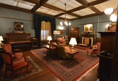 a living room filled with furniture and lots of windows