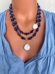 Sodalite Double Strand Necklace Set with Baroque Pearl Pendant This elegant necklace set is a great gift for yourself and your loved ones. Made from genuine Sodalite and Baroque Pearl beads. All metal ornaments are 18K gold plated and won't get darker in time! This collection comprises two exquisite necklaces that offer the versatility of being worn individually or elegantly layered together. (Longer one is 18.5 inches and shorter one is 17 inches ) FREE SHIPPING ✈️✈️ - All orders get shipped wi Blue Gemstone Necklace, Baroque Pearl Pendant, Sodalite Crystal, Metal Ornaments, Double Strand Necklace, Elegant Necklace, Jewelry Christmas, Necklace Blue, Metal Ornament