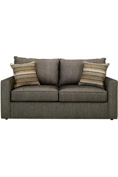 a gray couch with two pillows on it