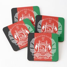 three coasters with the flag of afghanistan on one side and an emblem on the other