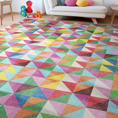 a brightly colored rug in a living room