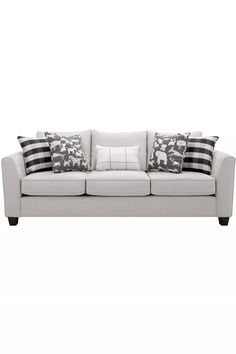 a white couch with black and white pillows