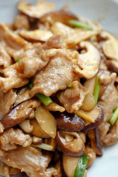 chicken and mushroom stir fry on a white plate