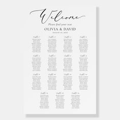 the wedding seating chart is shown in black and white with calligraphy on it's side