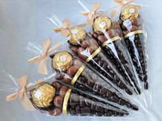 chocolate candies wrapped in cellophane and tied with gold ribbon