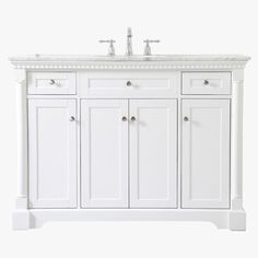 a white bathroom vanity with two sinks