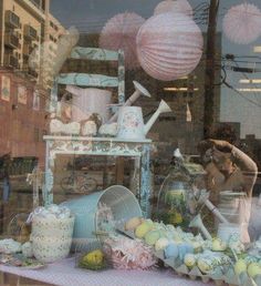 a window display with pink and blue decorations