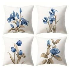 four pillows with blue flowers on them