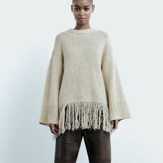 Fringed 100% Wool Sweater Sweater Made Of 100% Wool . Round Neck And Long Sleeves . Fringed Hem And Rib Trim . Ecru Width: 24.5in Flat New With Fuzzy Skirt, Dark Green Sweater, Knot Sweater, Long Black Cardigan, Oversized Knit Cardigan, Fringe Sweater, High Neck Sweater, Pink Crewneck, Detailed Sweater