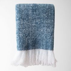 a blue and white blanket with the word swizz on it's side