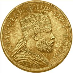 an old gold coin with a man's head on it