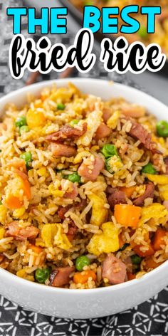 the best fried rice with ham and peas in a white bowl on top of a table