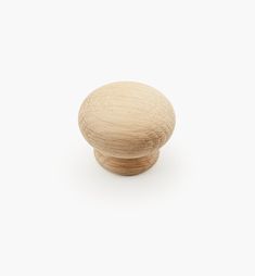 a wooden knob on a white background