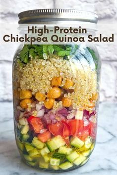 a mason jar filled with chickpea quinoa salad