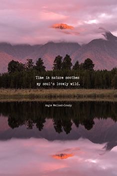 a lake with mountains in the background and a quote written on it that says time in nature soothes my soul's lovely wild