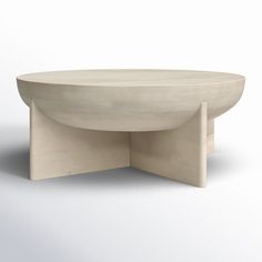 an oval table with two curved legs and a circular base on the top, sitting in front of a white background