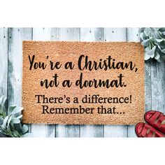 a door mat that says you're a christian, not a damat there's a difference remember that