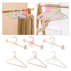 four pairs of clothes hangers with bows and beads on the top, two are hanging from