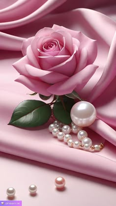 a pink rose and pearls on a pink satin