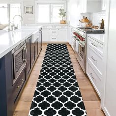 a black and white runner rug in a kitchen