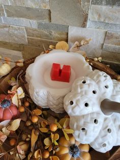 a basket filled with candles and other decorative items