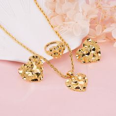 Material: Copper. Color: Gold. Necklcae Chain Length: 14",16",18",20",22". Ring Size: 5.0, 5.5, 6.0, 6.5, 7.0, 7.5, 8.0, 8.5, 9.0, 9.5, 10. Process: Gold plated. Recipient: Woman, Mom, Wife, Girl Friend, Children, Family. Product Type: Personalized Jewelry. Gift Type: Set. Jewelry Type: Name Ring, Necklace,Stud Earrings. Brand: Silviax Jewelry. Item: 2023S0104.  Discover elegance and sentiment with nugget love heart Set, featuring a personalized name ring,necklace, and stud earrings. This exquis Gold Nugget Rings, Heart Gold Earrings, Gold-plated Jewelry Sets For Mother's Day, Gold Plated Jewelry Sets For Mother's Day, Heart Nugget Ring, Gold Plated Heart Jewelry, Tarnish Resistant, Gold Plated Heart Shaped Tarnish Resistant Jewelry, Tarnish Resistant Gold Heart Pendant Jewelry, Tarnish Resistant Gold-plated Heart Jewelry