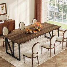 a dining room table with chairs and plates on top of it in front of a window