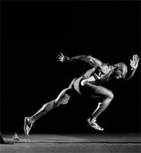 a black and white photo of a man running