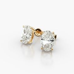 These 14K Yellow Gold Oval Shape Diamond Stud Earrings (1.50 CTW - H-I / SI1-SI2) are a classic and elegant pair of earrings that are sure to make a statement. The oval-shaped diamonds are set in a tapered basket that showcases their beauty. The 14K yellow gold setting gives them a timeless look. It is durable and tarnish-resistant, and will keep your earrings looking their best for years to come. These earrings are perfect for any occasion, from a special event to everyday wear.aka Diamond Stud Classic Oval Diamond Cut Earrings, Oval Diamond Earrings In Yellow Gold With Vvs Clarity, 14k Gold Oval Earrings With Diamond Cut, Timeless Oval Yellow Gold Diamond Earrings, Oval 14k Gold Diamond Earrings With Accents, Shimmer And Shine, Shimmer N Shine, Oval Earring, Yellow Gold Setting