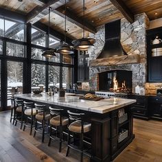 a large kitchen with an island in the middle and lots of counter space on one side