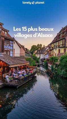 the cover of lonely planet magazine shows people sitting at tables on a bridge over a river