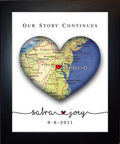 a heart shaped photo frame with the words our story continues and a map on it