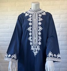 Lovely caftan dress from the late 70s/early 80s - the style and embroidery are very similar to tunics/dresses made in the Philippines during this era but this dress doesn't have a label. It's navy blue with elegant white embroidery and a henley style placket with four buttons to the waist. The caftan is unlined and finished with side slits that are also detailed with embroidery. No label -there is an old size tag. Measurements: tagged vintage size 12; this is similar to a modern M/L. Please note Blue Kaftan Dress, Blue Kaftan, Embroidery Boho, Embroidered Caftan, Blue Maxi Dress, Blue Maxi, Caftan Dress, Kaftan Dress, White Embroidery