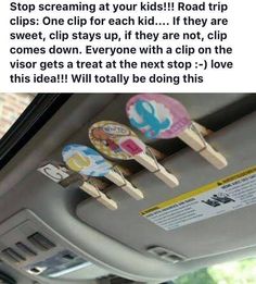 the inside of a car with three popsicles stuck to it's dash board