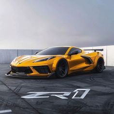 a yellow sports car parked in an empty parking lot