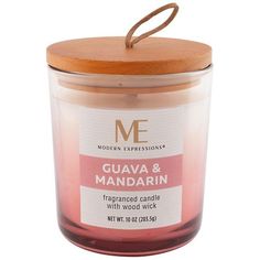 a candle with a wooden lid is shown on a white background and has the words guava & mandarin printed on it