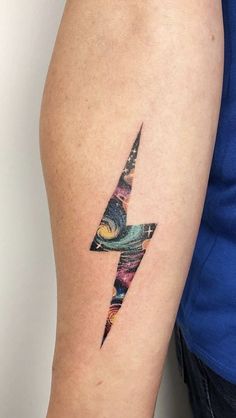 a person with a tattoo on their arm has a lightning bolt in the middle of it