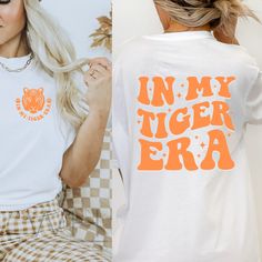 Tiger Era T-shirt. Bella Canvas Unisex T-shirt. Please note: design will not be as bright on dark fabrics. Color may vary slightly due to monitor settings. Made with 100% cotton.  Fabric blends: Ash - 99% Airlume combed and ring-spun cotton, 1% polyester; Heather colors - 52% cotton, 48% polyester; Athletic Heather 90% cotton, 10% polyester. Fit: All shirts are unisex fit, true to size, loose fit. Recommend going up 1-2 sizes for an oversized look. Please check the size chart. If you have any questions, please contact us. Please check your address to make sure it is your current address. Care Instructions:  For the best and lasting results, wash in cold water inside out. No bleach. Dry on low heat or hang dry. Do not iron over design.  Returns: Because this item is made to order, all sales Cheap Crew Neck Top With School Spirit, Cricket Designs For Shirts, Elementary Spirit Shirts, Spiritwear Designs School Spirit Wear, School Spirit Slogan Top With Relaxed Fit, School Spirit Slogan Top In Relaxed Fit, Relaxed Fit Tops With School Spirit Slogan, Spirit Shirts School Ideas, Vintage School Shirt Designs